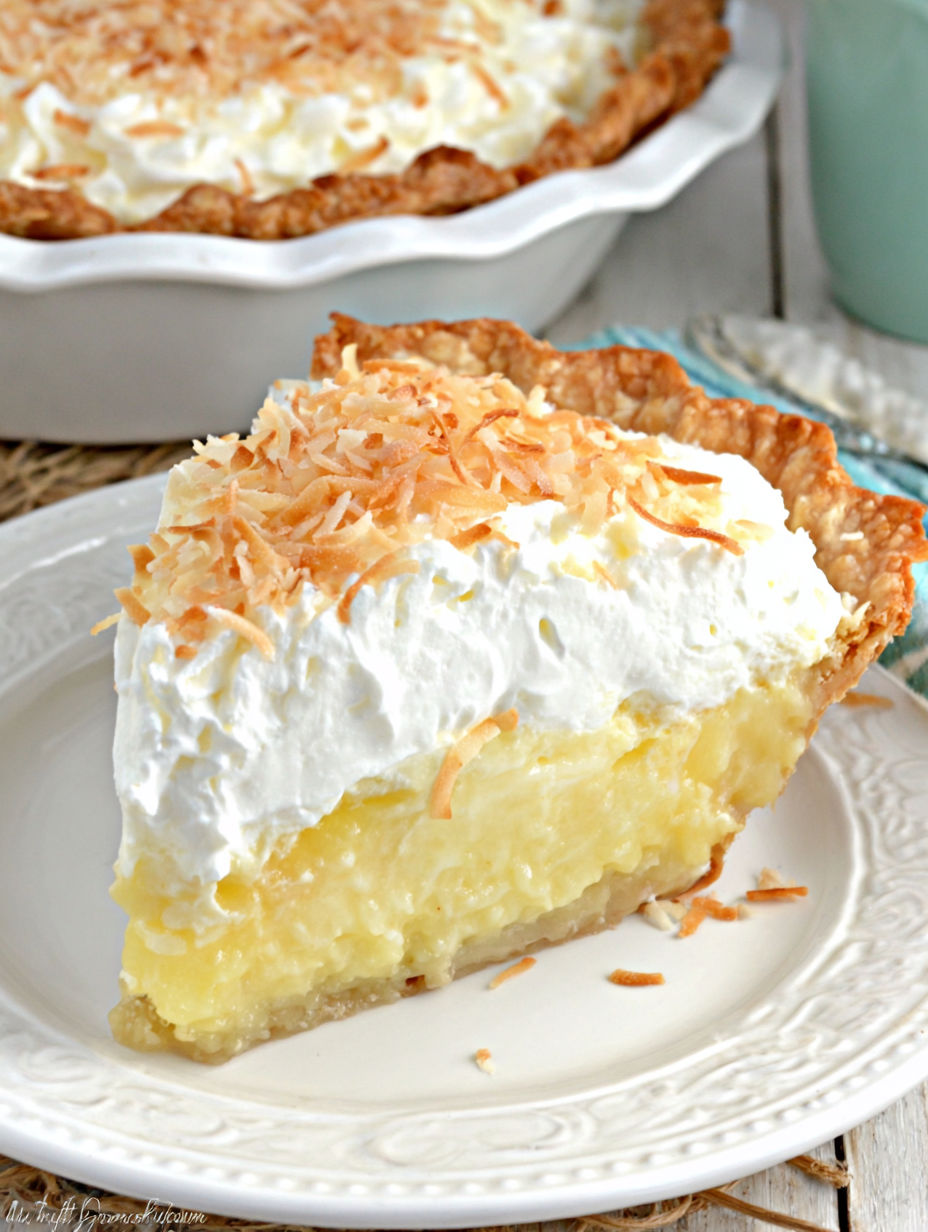 A slice of pie with coconut on top.