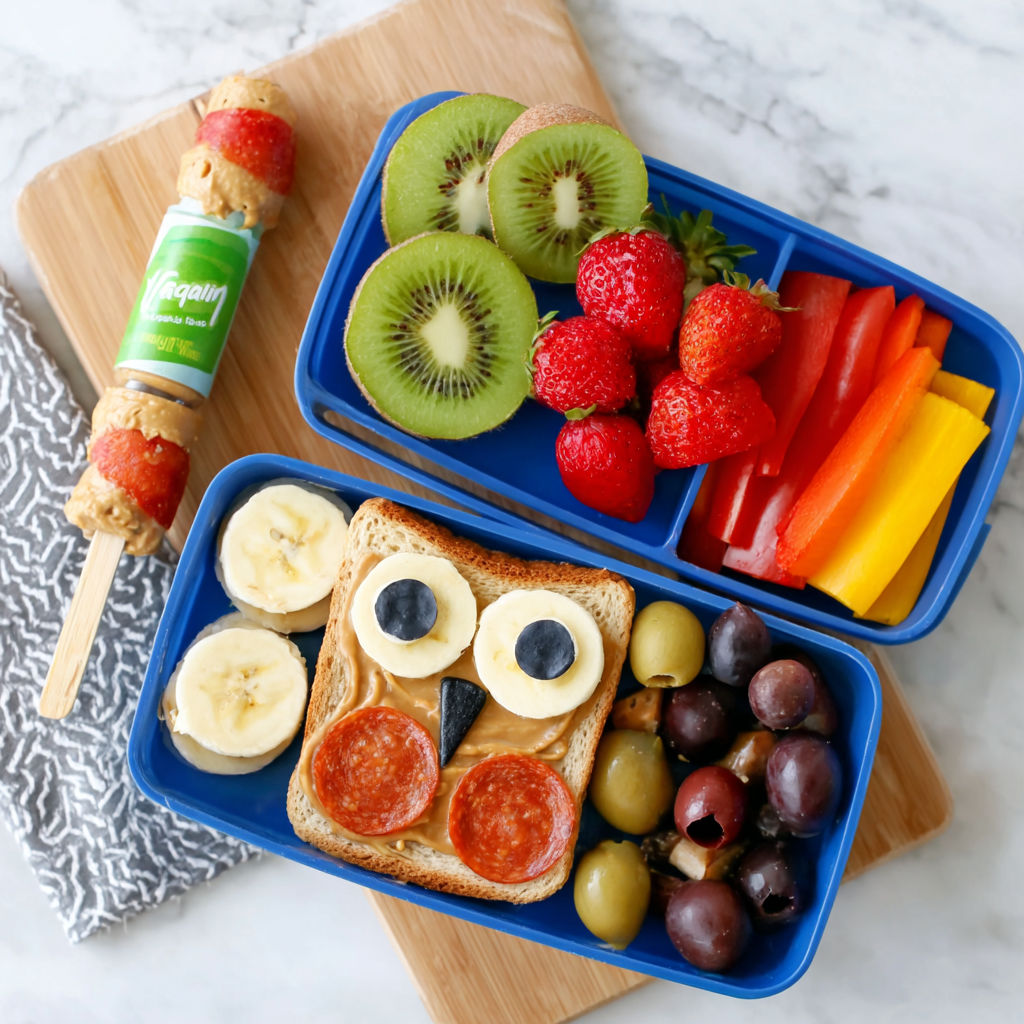 A fun lunch idea for kids includes a banana, kiwi, strawberries, and carrots.