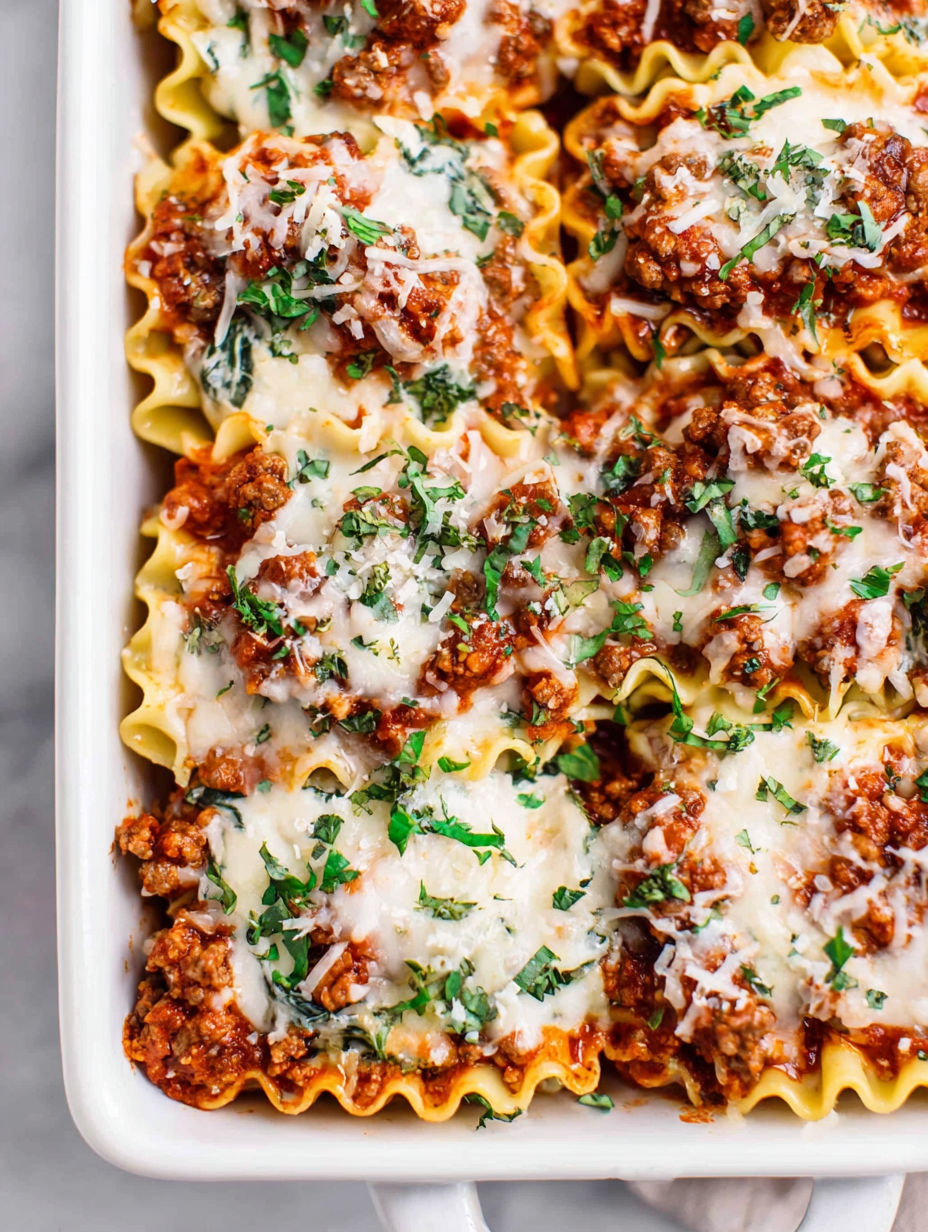 A dish of lasagna with meat and cheese.