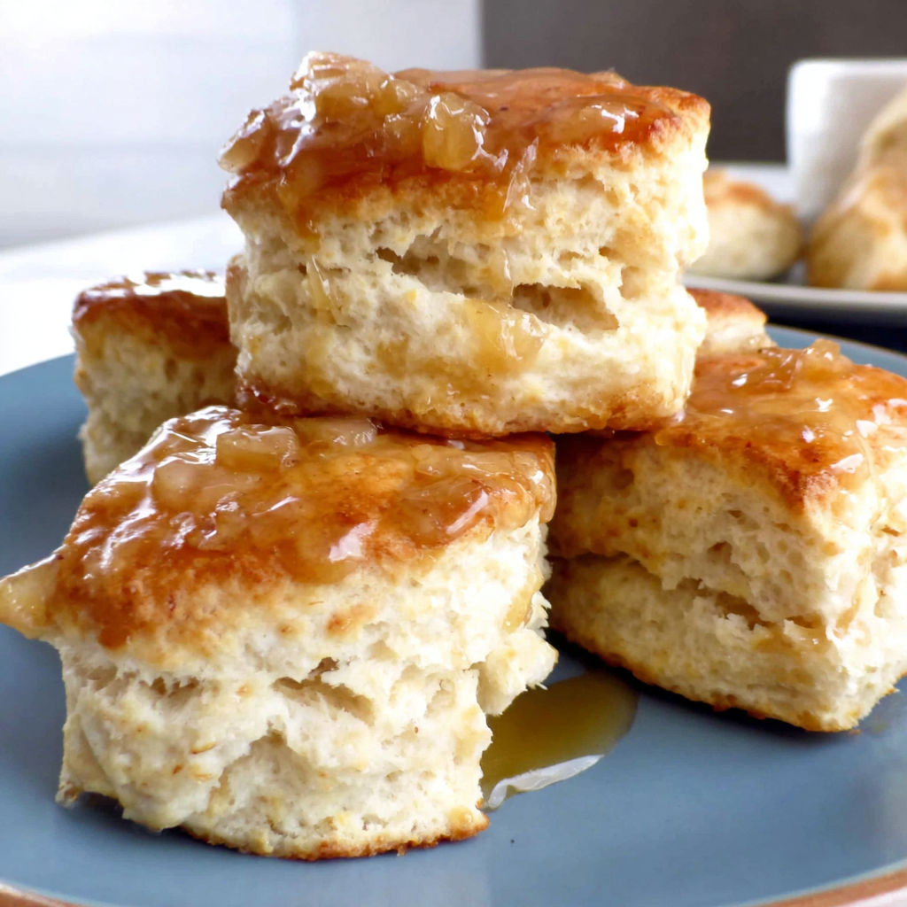A stack of biscuits with a honey glaze.