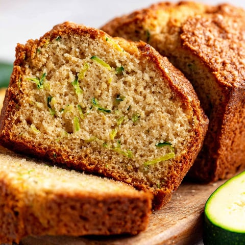 A loaf of bread with a slice missing.