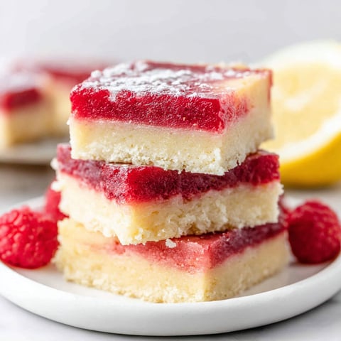 A stack of lemon raspberry bars.