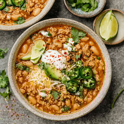 A bowl of turkey and white bean chili.