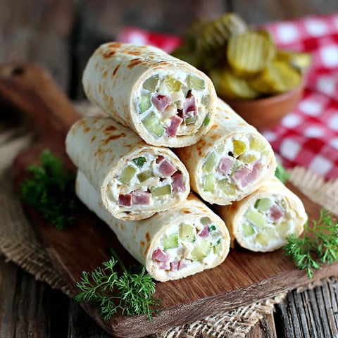 A stack of pickle dip roll-ups.